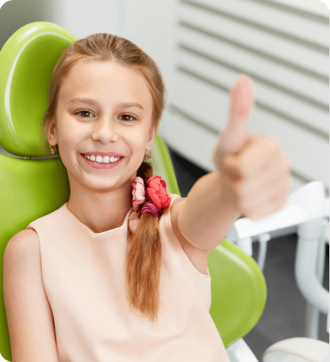 photo of smiling team member with child patient